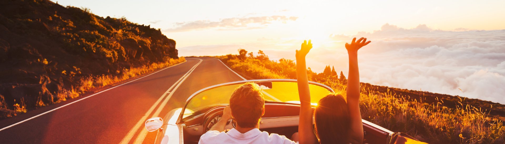 couple driving sunset