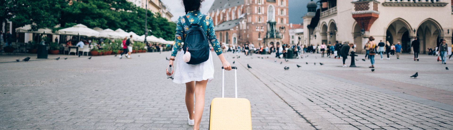 woman solo travel with suitcase